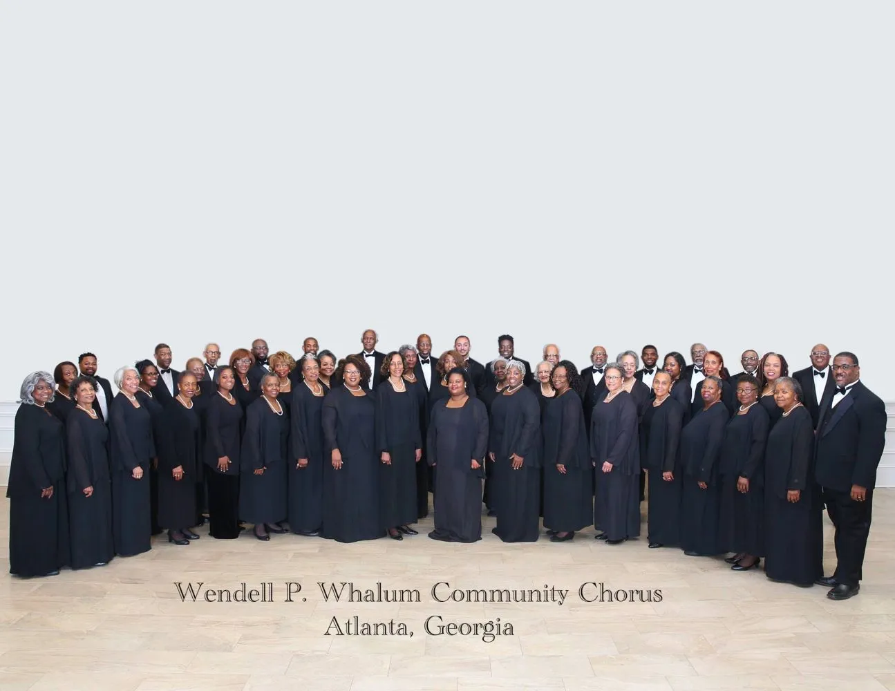 The Wendell P. Whalum Community Chorus on risers in concert dress
