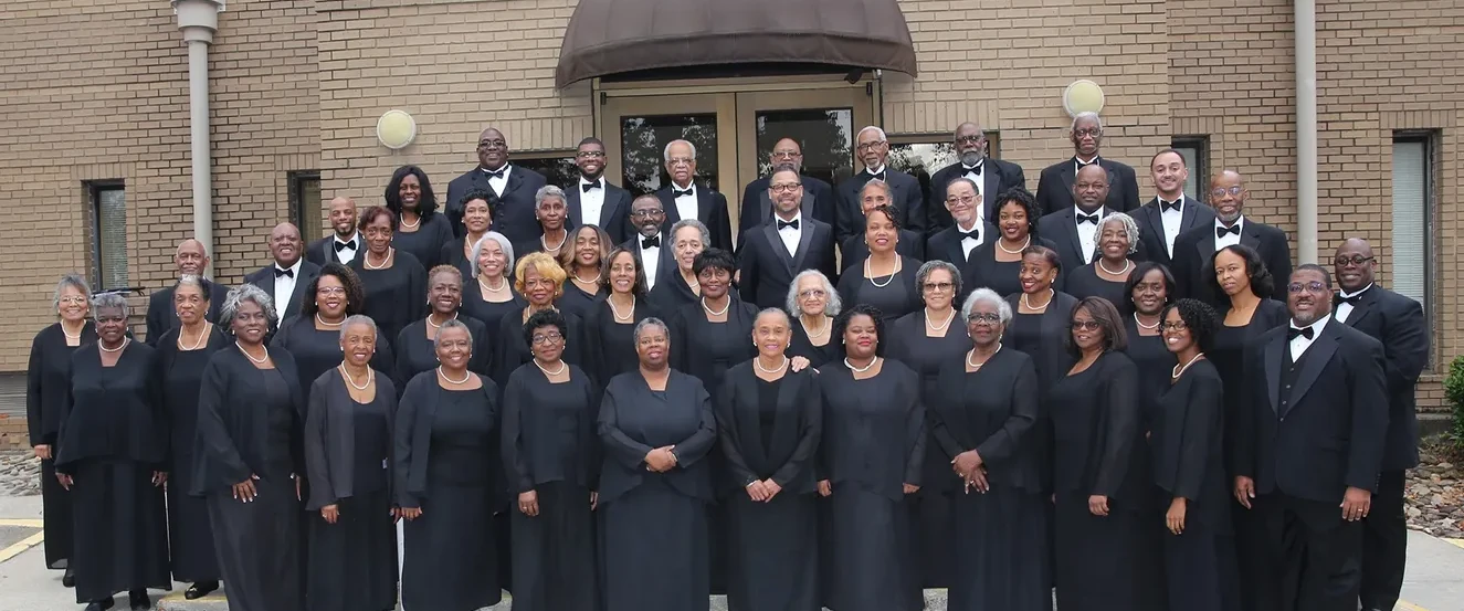 The Wendell P. Whalum Community Chorus on risers in concert dress